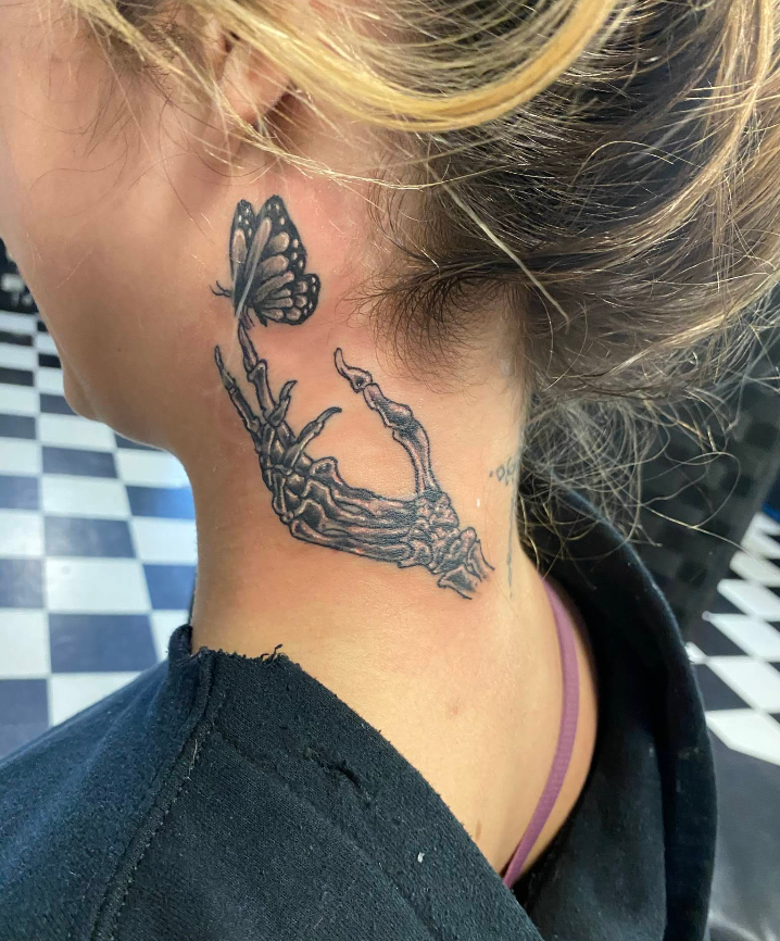 Skeletal Hand & Butterfly